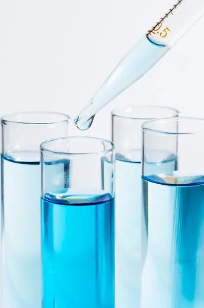 Laboratory glassware with a pipette dropping liquid — water and air testing by Greenwave China.